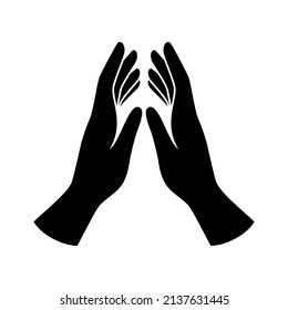 Praying hands black silhouette icon vector. Human hands in prayer icon vector isolated on a white background