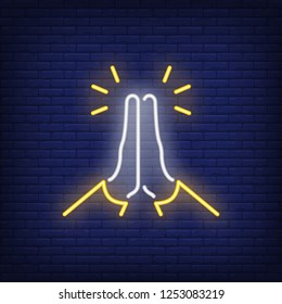 Praying hands neon sign. Gratitude or prayer design. Night bright neon sign, colorful billboard, light banner. Vector illustration in neon style.