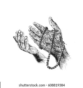 Praying hands and rosary