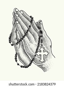 praying hands and rosary