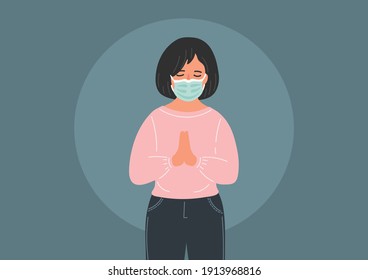 Praying woman in medical mask. Religion, Christianity, faith in Covid-19 period concept. Woman with closed eyes sincerely prays.