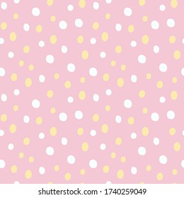 Precious handmade seamless texture. Abstract polka dot ornament with white and yellow dots on pink background.  Ink illustration. Hand drawn ornament for wrapping paper.