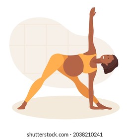 Pregnant African American woman doing yoga at home. Woman in sportswear makes Triangle Pose. Lady happy and enjoys pregnancy. Women healthy life style concept. Prenatal Utthita Trikonasana pose