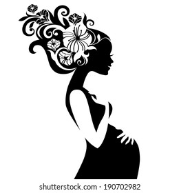 Pregnant beautiful woman silhouette with floral hair