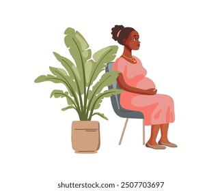 Pregnant black woman in pink dress sits on chair near potted home plant, side view on white background