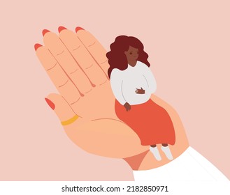 Pregnant black woman sits on a doctor's hand during a check-up. Maternity for women who need support and assistance. Hospital care, gynecologist, psychological and mental health concept.
