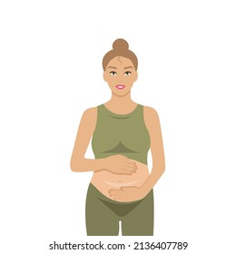 a pregnant girl in a green suit hugs her belly and gently strokes her unborn child