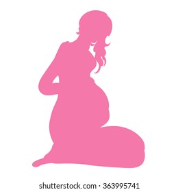 pregnant silhouette sitting in a pose on her knees