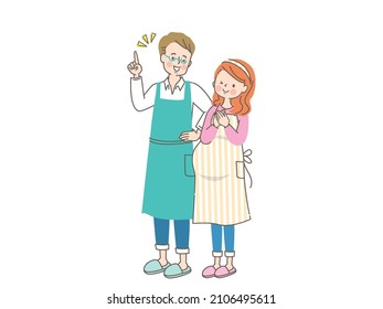Pregnant smiling woman and husband in apron