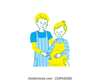 Pregnant smiling woman and husband in apron