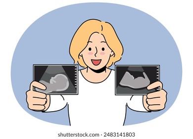 Pregnant woman boasts of ultrasound images of baby in womb of future mother in prenatal period. Pregnant blonde girl smiles and prepares to become mom and give birth to healthy newborn