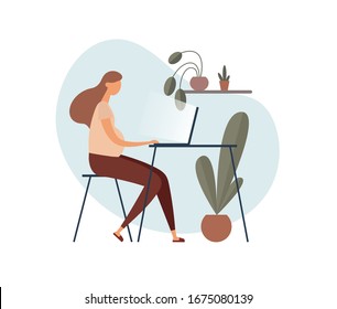 Pregnant woman in casual clothes sitting at table and using laptop while working on remote project in cozy home office decorated with potted plants