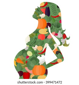 Pregnant woman diet concept. Silhouette of pregnant woman and  vegetables.