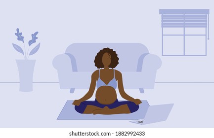 Pregnant woman doing online yoga class at home