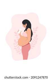 Pregnant woman drinking a glass of milk while holding her abdomen