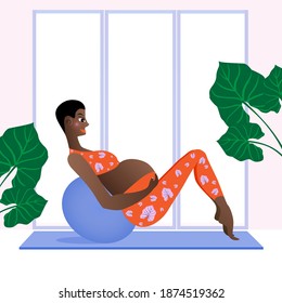 Pregnant woman exercise with the birthing ball to strengthen the stomach and back muscles, improve posture, and prepare the body for delivery