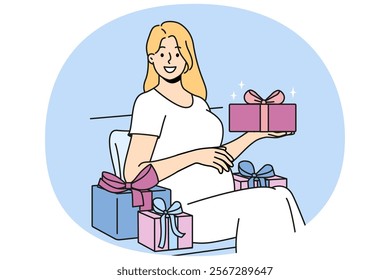 Pregnant woman with gift box strokes belly and looks at screen in anticipation of birth of baby. Pregnant girl is preparing to become mother and enjoys gifts from friends and relatives