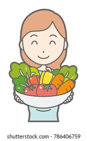 A pregnant woman in green dress has vegetables