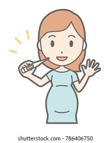 A pregnant woman in green's clothes has a thermometer