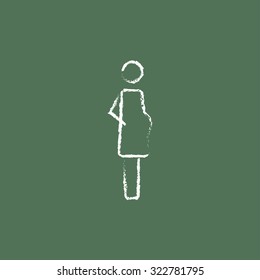 Pregnant woman hand drawn in chalk on a blackboard vector white icon isolated on a green background.