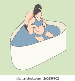 Pregnant Woman Having Natural Birth with Husband in a Tub of Water.  