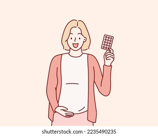 Pregnant woman holding blister of medicine in her hand. Hand drawn style vector design illustrations.