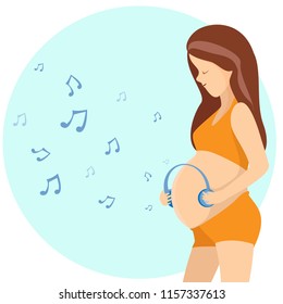 Pregnant woman hugging her belly and  listen the music ,womans health concept