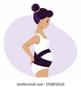 A pregnant woman with a large belly in a maternity bandage. A pregnant girl in her underwear.