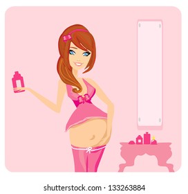 Pregnant woman lubricates the stomach remedy against stretch marks