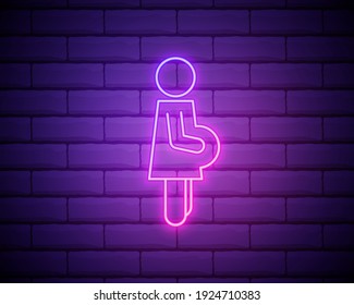 Pregnant woman neon sign. Bright glowing symbol on a brick wall background. Neon style icon