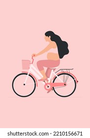 
pregnant woman riding a bicycle on a pink background