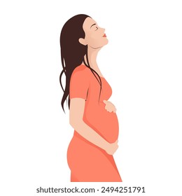 Pregnant woman side view in a orange dress tenderly holds her belly with a happy smile