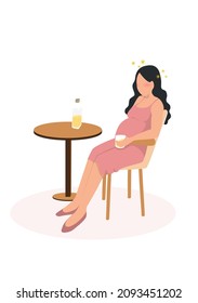 A pregnant woman sits on a chair drinking booze.