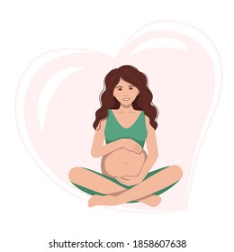 A pregnant woman is sitting and hugging her big belly and doing meditation .