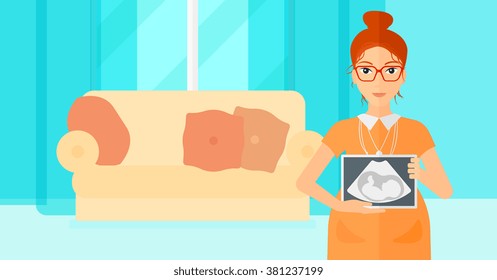 Pregnant woman with ultrasound image.