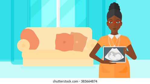 Pregnant woman with ultrasound image.