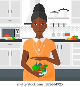 Pregnant woman with vegetables.