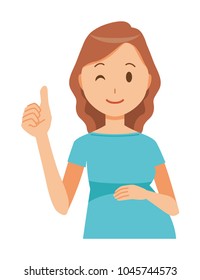 A pregnant woman wearing blue clothes is showing thumbs up