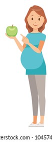 A pregnant woman wearing blue clothes has a green apple