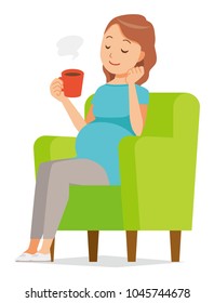 A pregnant woman wearing blue clothes is sitting on a sofa and drinking coffee