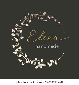 Premade logo design with golden floral wreath. Tree branches and leaves. Feminine logotype template.