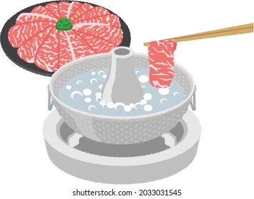 Premium A5 Wagyu Beef raw sliced and put on the dish for Shabu in the Japanese restaurant. Placed on a table with a boiling pot boiling. 