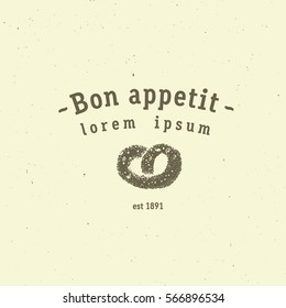 Premium bakery emblem with fresh baked soft pretzel,