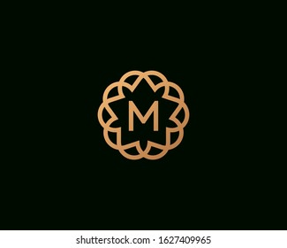 Premium letter M vector logotype. Elegant floral frame with letter icon logo. Alphabet symbol mark.