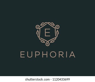 Premium linear shield monogram letter E logotype. Elegant crest leaf stamp icon vector logo. Luxury alphabet frame symbol. 