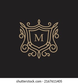 Premium linear shield monogram letter M logotype
