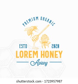 Premium Local Honey Sign, Symbol or Logo Template. Hand Drawn Bee, Spoon and Clover Flower Sketch with Retro Typography. Vintage Emblem with a Comb Background. Isolated.