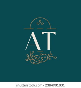 premium AT logo monogram with gold circle frame. luxury initials design minimal modern typeface.
