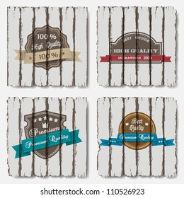 Premium Quality Labels on old wood background