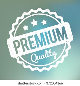 Premium Quality rubber stamp white on a blue bokeh fog background.